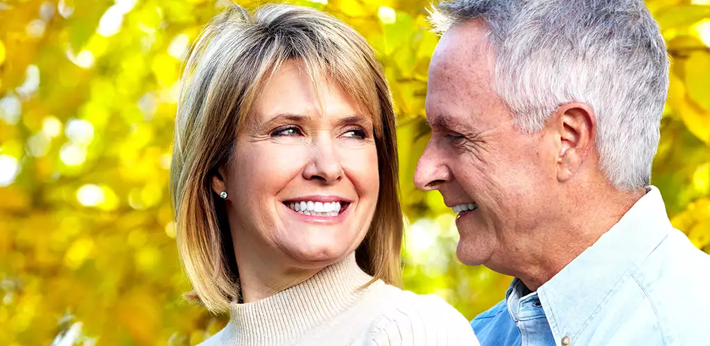 Older Smiling Couple with Full Mouth Dental Implants